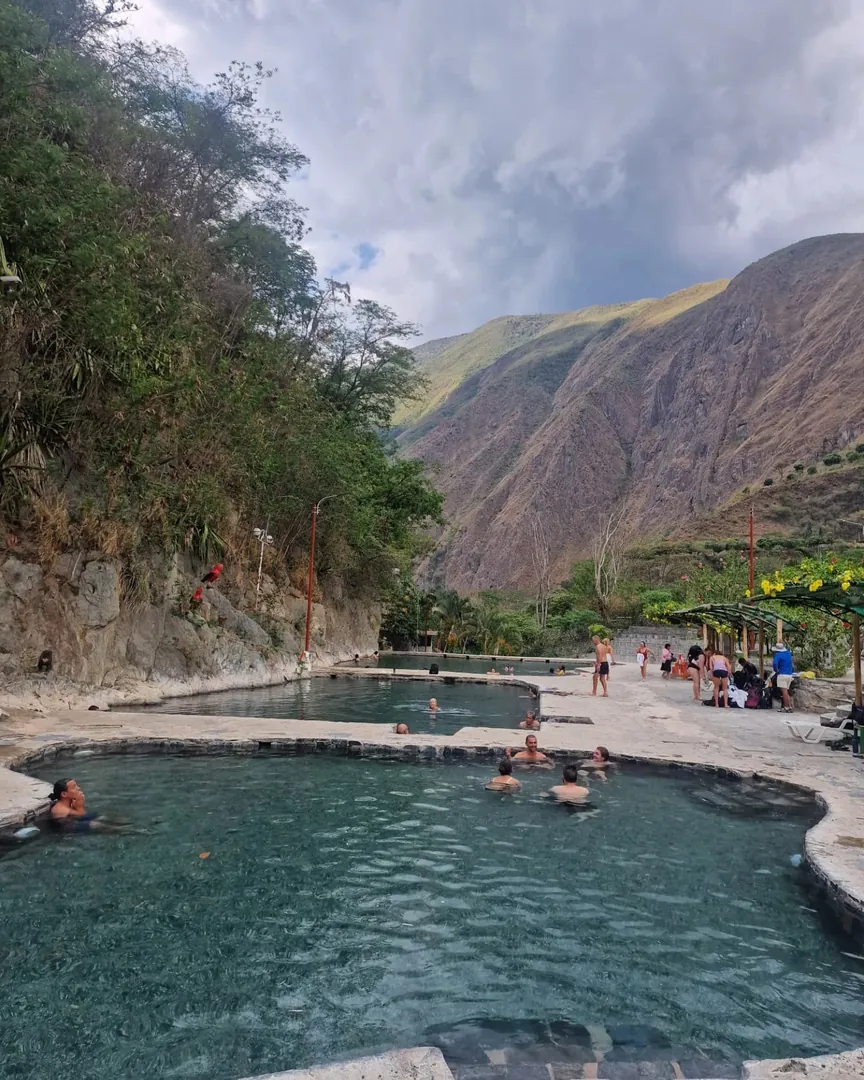 Turquoise thermal water at Cocalmayo surrounded by mountains
