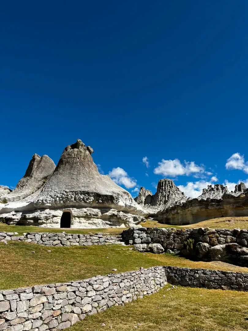 Conical formations of the stone forest under a blue sky